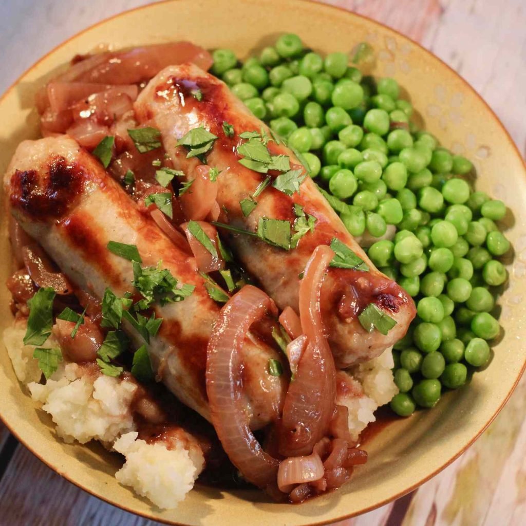 Ultimate Comfort: Savory Bangers and Mash with Rich Onion Gravy