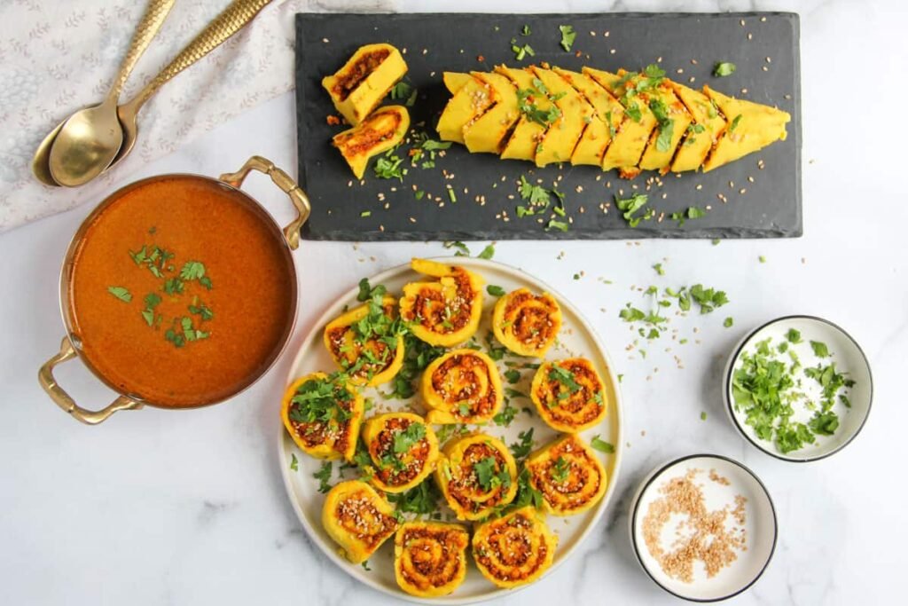 Masawadi on a serving platter garnished with cilantro and served alongside rassa